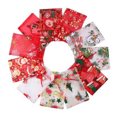 China Wholesale Cheap Eco-Friendly Santa Claus Elk Customized Logo Beam Christmas Snowflake Star Yarn Bag Gift Storage Bag for sale