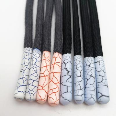 China Sustainable Custom Silicone Dipped Ends Around Woven Cords For Garment for sale