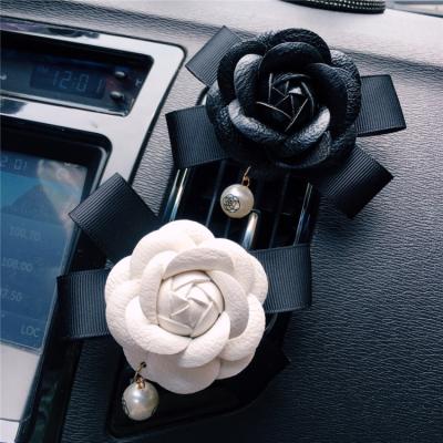 China Creative Top Perfume Diffuser Car Camellia Air Vent Fragrance Car Air Conditioning Mouth Decoration Clip for sale