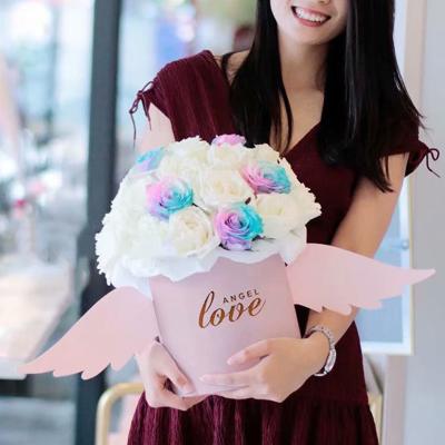 China Wedding Decoration Portable Round French Angel Holding Bucket Flower Bucket Gift Box For Dry Flowers Fresh Flower for sale