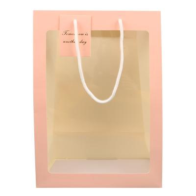 China Recycled Materials Paper Shopping Bag Transparent Window Reusable Flower Toy Packaging Paper Bags for sale