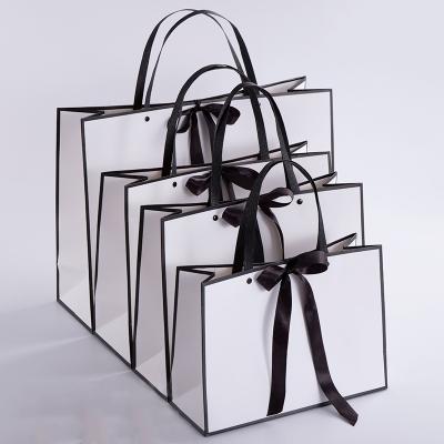 China Recyclable Luxury Custom Shopping Bags With Ribbon Foldable Reusable Paper Bag With Own Logo Gift Bag for sale