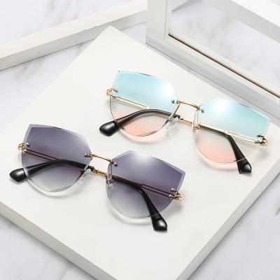 China 2021 New Rimless Frameless Sunglasses For Women Polygonal Gradient Sun Glasses Shades Blue Metal for sale