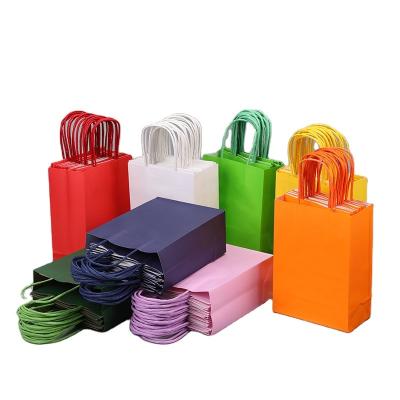 China Recycled Materials Wholesale cheap boutique reusable kraft paper bag with handle for sale