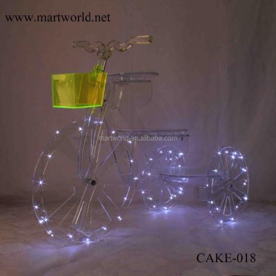 China 2021 New Cinderella bicycle acrylic birthday cake stand cake & wedding decoration wholesale cake decorating suppliers CAKE-018 for sale