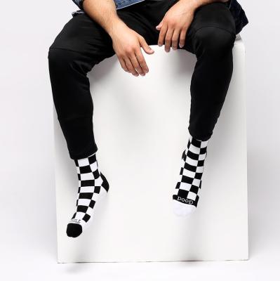 China Viable White Black Plaid Pattern Socks Custom Cotton Women Men Casual Socks for sale