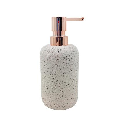 China Viable Terrazzo 200ml Soap Dispenser Round Liquid Liquid Pump Bottle Concrete Body With Mini Sands Rose Gold ABS Head For Bath for sale