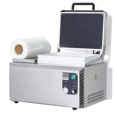 China Food DJT-250VS Manual Seafood Meat Food Packaging Machine Vacuum Skin Tray Cardboard Sealer for sale