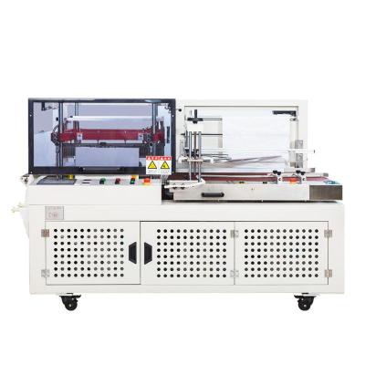 China Food DQL6560PEG Automatic Clothing Paper Box Packaging Plastic Bags Wrapping PE Plastic Film L bar Sealing and Cutting Machine for sale