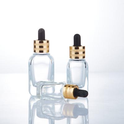 China Custom Personal Care Logo Screen Printed 10ml 20ml 30ml 50ml 100ml Square Grid Bottom Clear Glass Dropper Bottles With Gold Ring for sale