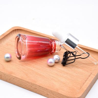 China Personal Care Essential Oil Dropper Bottle 25ML Serum Packaging Container Glass Pyramid Customized Glass Bottle Supplier for sale