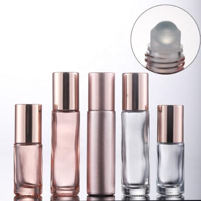 China Personal Care Roll On Round Perfume Bottle Pink Rose Gold Essential Oil Perfume Roller Bottles for sale