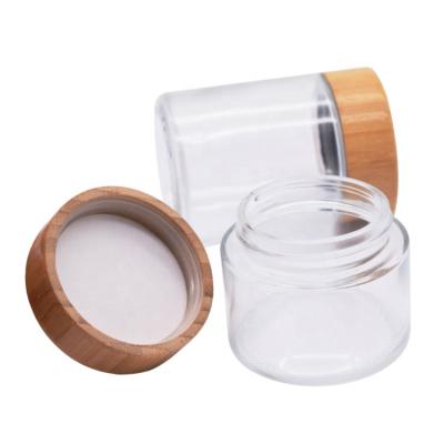 China Personal care round glass empty child jars safty body scrub container manufacturing skin care packaging glass jar with child safety cover for sale