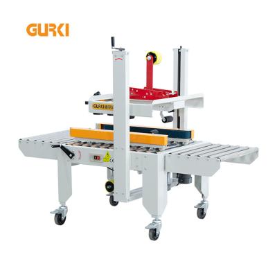 China Small Size Automatic Food Sealing Machine Belt Driven Carton Sealer for sale