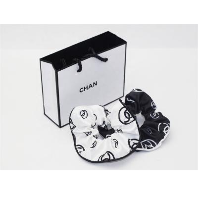 China Black and white classic designer fashion lady hair accessories all-match satin temperament famous hair ring classic hair tie for sale