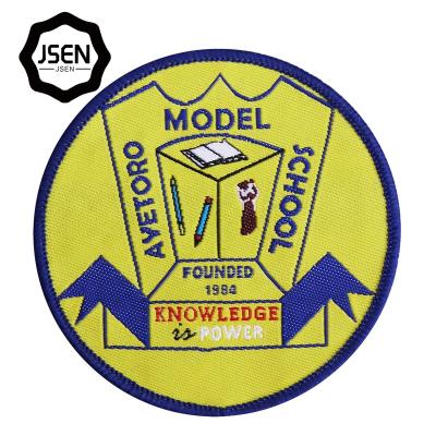 China Hot High Quality Custom Stock Embroidered Iorn Fashion Round Woven Patch Woven Fabric Badge And Accessories On Embroidery Patches For School Uniform for sale