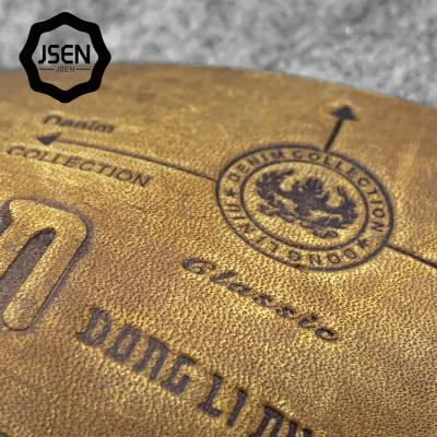 China Viable custom metal logo embossed designer leather patch/labels/tags for clothes/leder markenlabel for jeans for sale