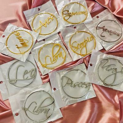 China TRENDY Tarnish Free 18k Gold Plated Stainless Steel Cursive Horoscope 12 Zodiac Sign Circle Earrings for sale