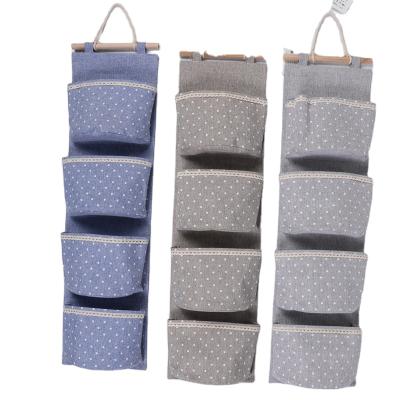 China Behind The Doors/On Walls Four Pockets Wall Hanging Storage Organizer Cotton Canvas Storage Bag Behind The Door Hanging Closet Organizer for sale