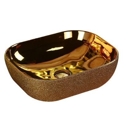 China Modern Oval Shape Luxury Ceramic Gold Countertop Gold Sink Bathroom for sale