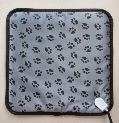 China Paw Print Waterproof Stocked Design 110V Heated Waterproof Pet Anti Bite Electric Heating Mat Cover Electric Pet Bed For Dog Cat for sale