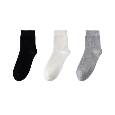 China Sporty White Breathable Wool Mid Calf Bumps Sports Absorbent Running Thigh High Solid Color Deodorant Sweat Socks for sale