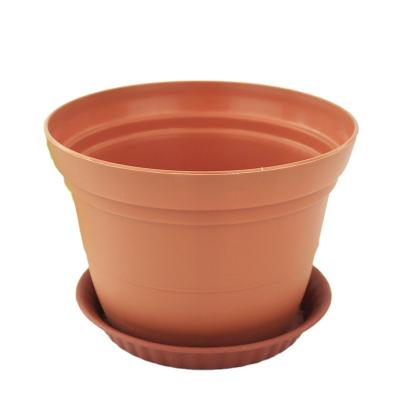 China Durable resin round basin for the balcony flower pot round flower pot with holes at the bottom of the good air permeability for sale