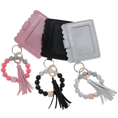 China The promotion gift silicone bead bracelets and bracelets card holder key chain wristband bracelet key chain wallet bracelets for sale