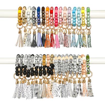 China Hot Selling Bead Key Chain Bangle Bracelet Retro Promotion Gift Bead Key Chain PU Colorful Wooden Leather Tassel Bracelets for sale