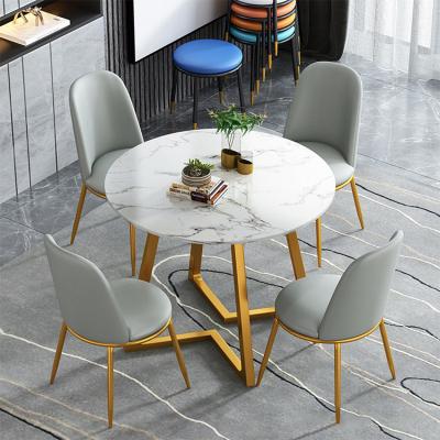 China New Design Comfortable Restaurant Cafe Shop Simple Round Shaped Stable Tables And Chairs Metal Leg Furniture Set for sale