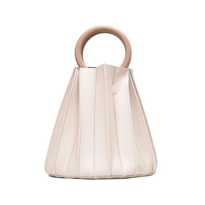 China 2021 Fashion Personalized Women's Fashion Solid Color Slotted Pleated Bag With Ring Handle for sale