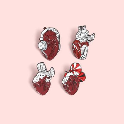 China Europe Musical Instrument Custom Enamel Heart Pin Anatomy Phonograph Headphone Pin Saxophone Brooches Music Lover Badges Pin for sale