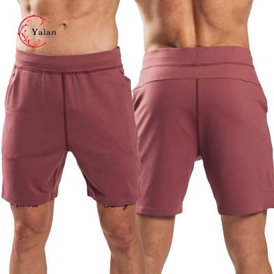 China Custom Logo Woven Exercise Training Shorts Men Fitness Anti-Wrinkle Double Running Squat Shorts With Pockets for sale