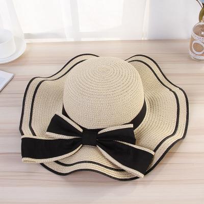 China Wholesale Wide Sun-proof Hat Factory Japan And Beach Brim Summer Style Korean Big Bow Brim Wavy Women Straw Hat Women for sale