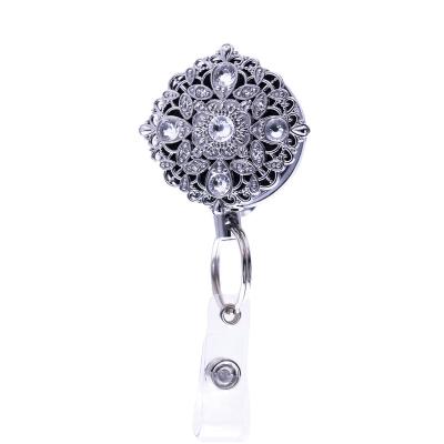 China Hot Selling Pink Gem Retractable Badge Reel Metal Fashion Badge Twirl Retractable for sale