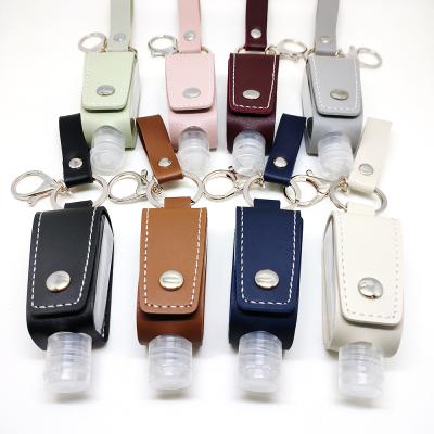 China Beautiful Designer Custom Portable Tassels Hand Collocation Key Chain Wholesale Sanitzer Leather Holder for sale