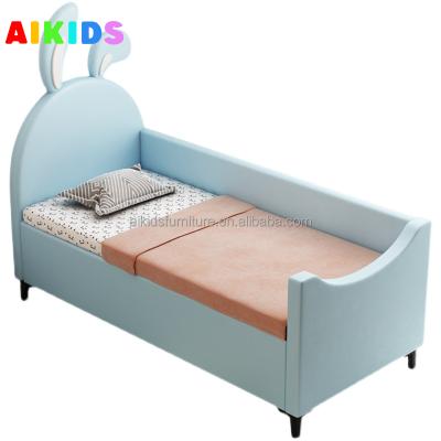 China Cozy Kids Patchwork Bed with Railing Boys Bedside Widened Extension Edge Baby Fabric Soft Wrapped Solid Wood Crib for sale