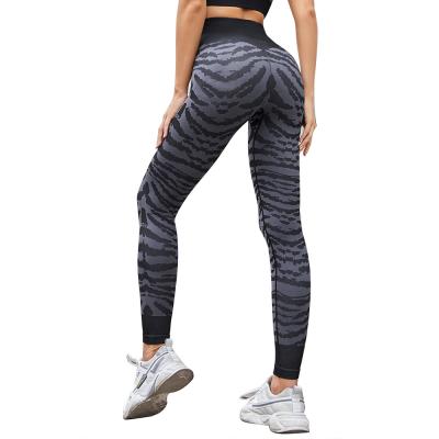 China Antibacterial leggings printed striped yoga pants European and American winter peach hip pants tight fashion sports naked pants for sale