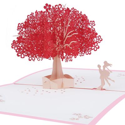 China Romantic Europe Sakura Red Card 3D Pop Up Greeting Cards with Envelope Valentines Day Cherry Tree Cherry Blossom Couple for sale