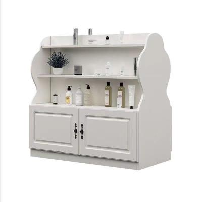 China Commercial Display Perfume Nail Polish Oil Double Side Cosmetic Display Cabinet With Drawer for sale