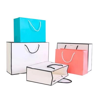 China Recycled Materials Wholesale Custom Printed Logo Luxury White Paper Bag Retail Boutique Shopping Gift Paper Bags With Your Own Logo for sale