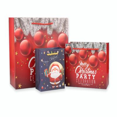 China Recycled Materials Factory Christmas Paper Bags Cardboard Custom Bags With Handle Tag For Christmas Holiday for sale