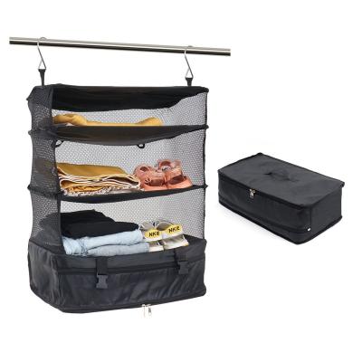 China 3 Layer Luggage System Suitcase Organizer Collapsible Closet Hanging Travel Portable Multi-Function Shelves And Packing Cube for sale