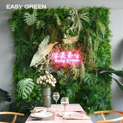 China Eco-friendly artificial grass wall green customized tropical artificial plant wall backdrop wall wedding decoration shop background for sale