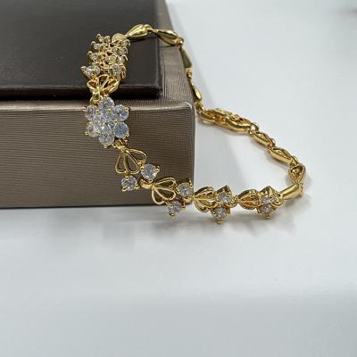 China TRENDY Gold Flower Bracelet Women, Gold Plated Fashion Women Friendship Cubic Zirconia Stainless Steel Charm Custom Botanical Chain Bracelet for sale