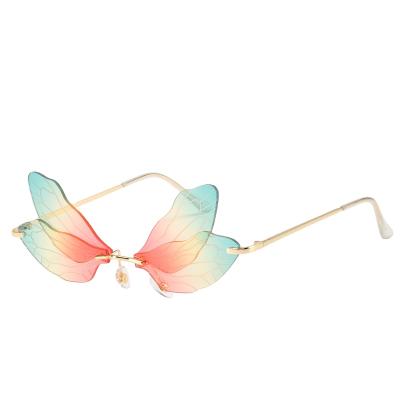 China Fashion Sunglasses 2021 2022 New Fashionable Fly Insect Elf Fairy Wing Sun Glasses Stylish Women Personality Rimless Sunglasses for sale