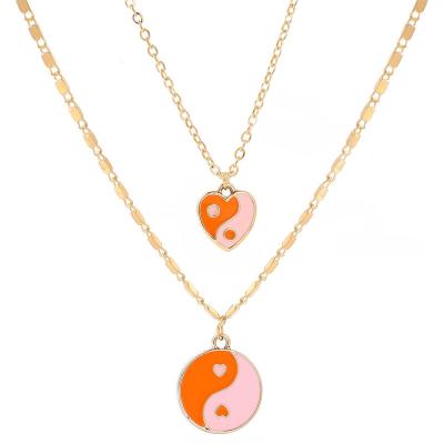 China Environmentally Friendly Fashion Gold Plated Double Layered Enamel Chain Heart Around Tai Chi Yin Yang Pendant Necklace Jewelry For Women for sale