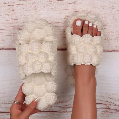 China Unisex Household EVA Massage Bubble Slides New Fashion Trend Summer Lychee Bubble Slippers Slippers For Women Men for sale