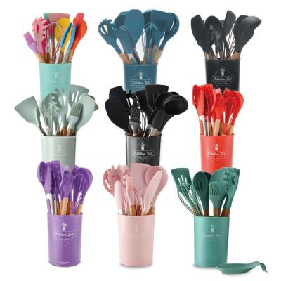 China Wooden kitchenware 11 handle silicone viable barrel storage seven sets of kitchenware 9 color silicone egg beater spoon shovel pot for sale