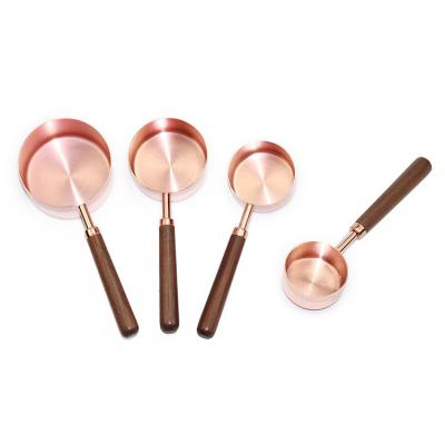 China Sustainable Amazon Vends Rose Gold Walnut Handle Copper Plated Measuring Doser Cup for sale